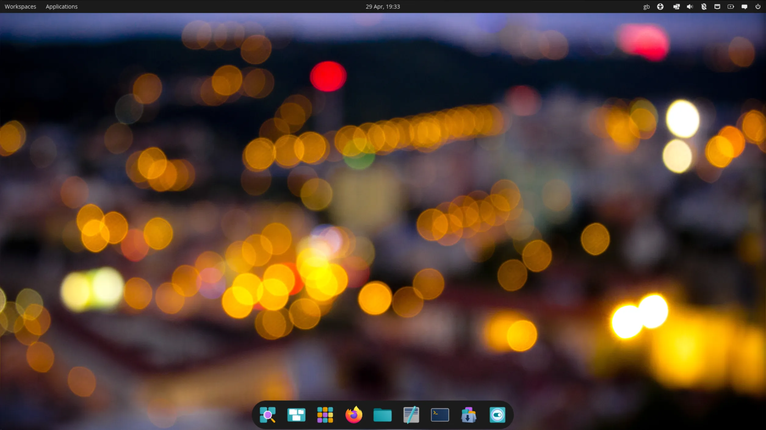 Screenshot of a newly installed virtual machine instance of AerynOS, Cosmic edition showing the about this system page with the new default AerynOS wallpaper
