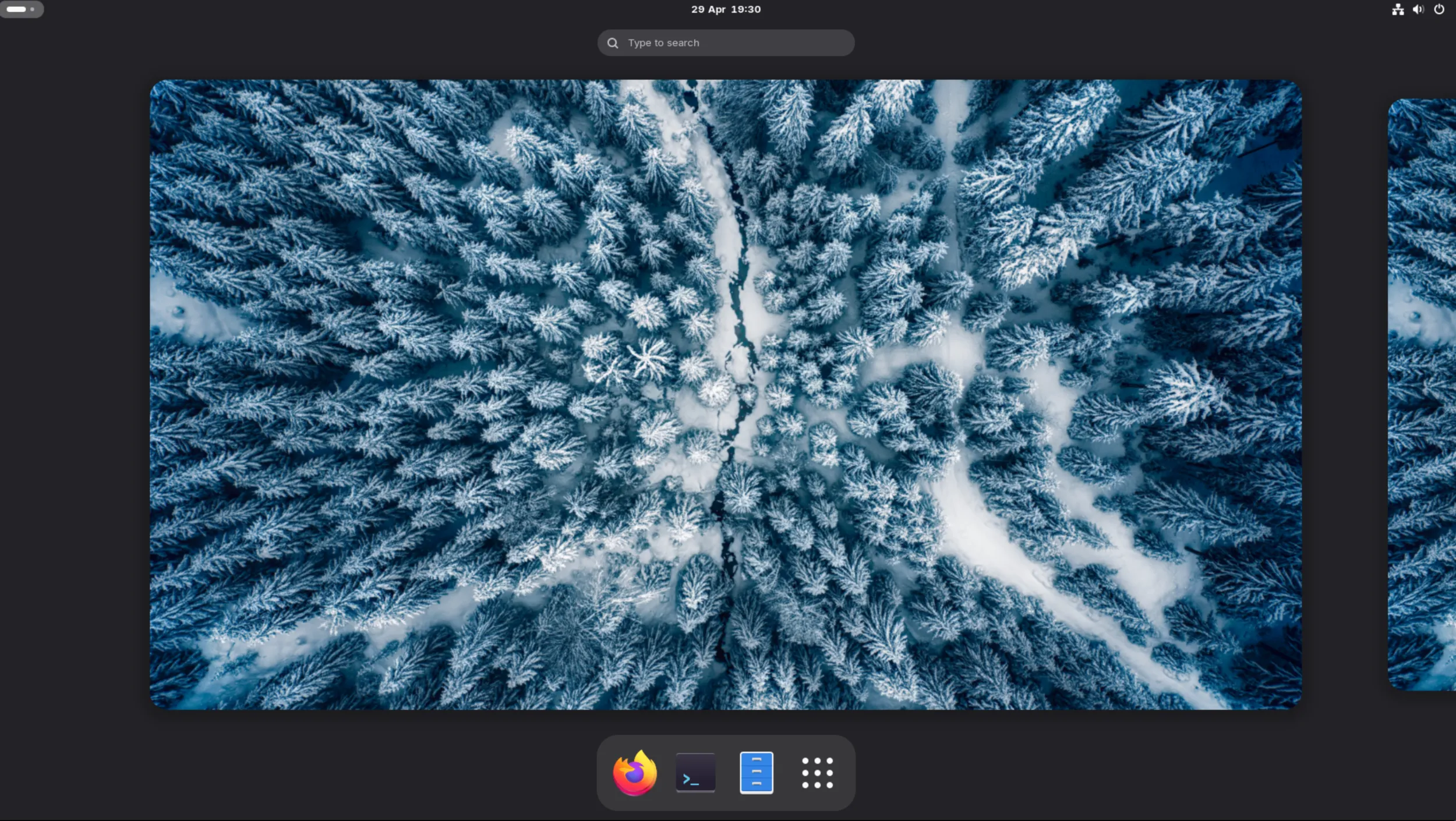 Screenshot of a newly installed virtual machine instance of AerynOS, Gnome edition showing the about this system page with the new default AerynOS wallpaper
