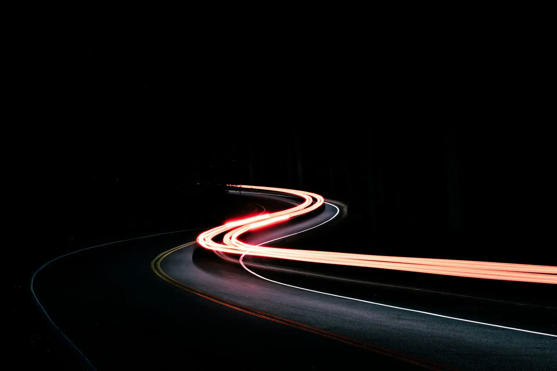 A car light trail signifying moving at pace